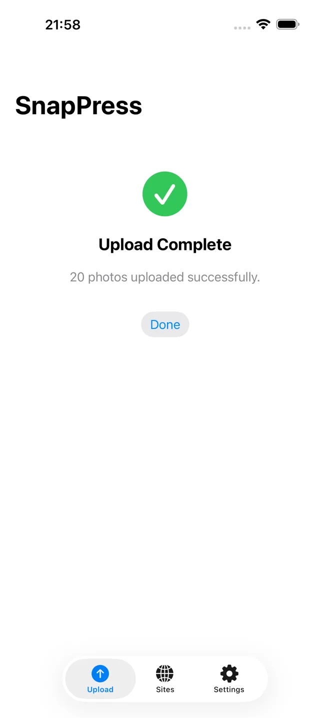 SnapPress upload-complete screen on iPhone confirming the batch of photos finished uploading to WordPress